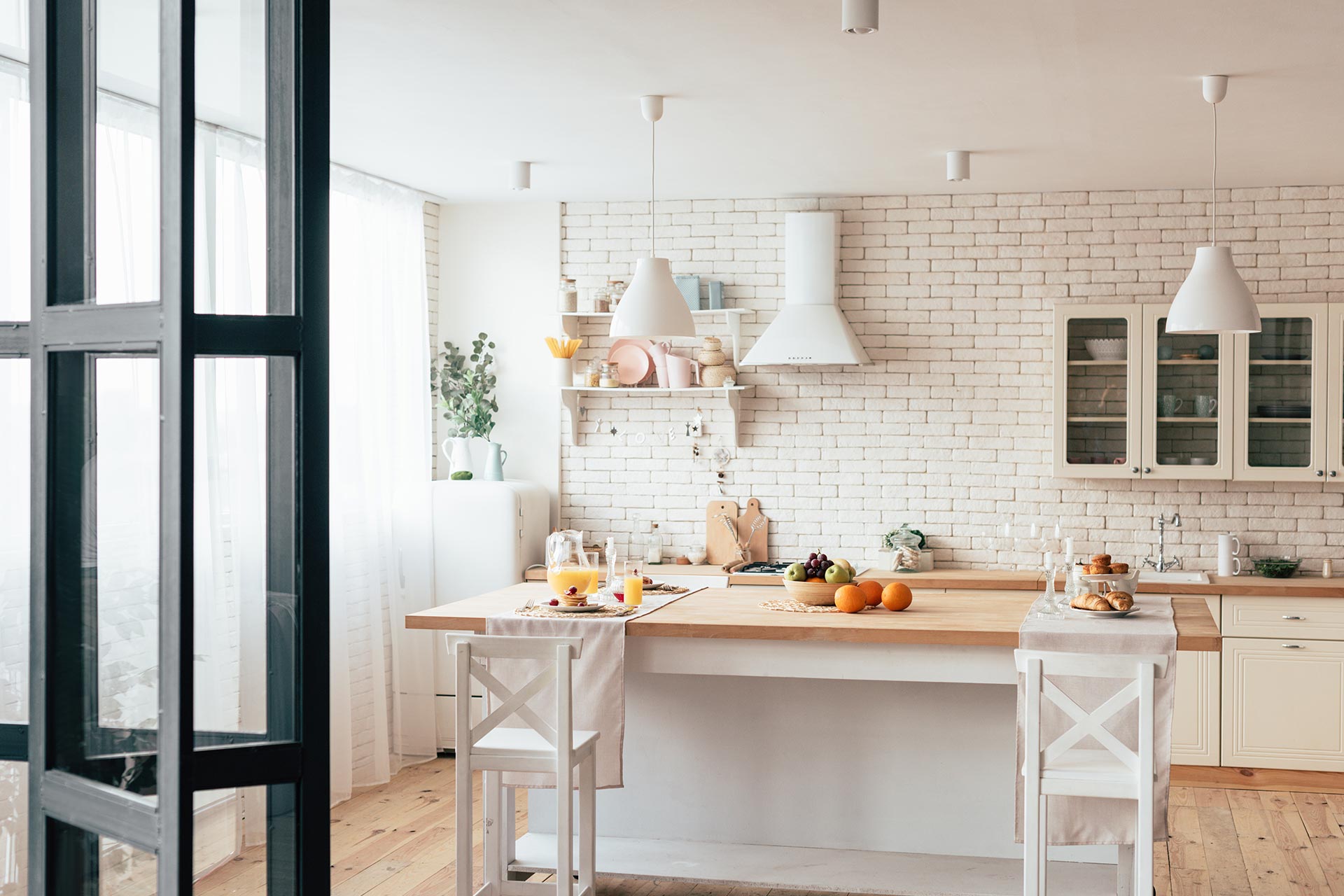 cozy-modern-kitchen-with-served-table-and-chairs-2022-11-02-00-40-56-utc.jpg