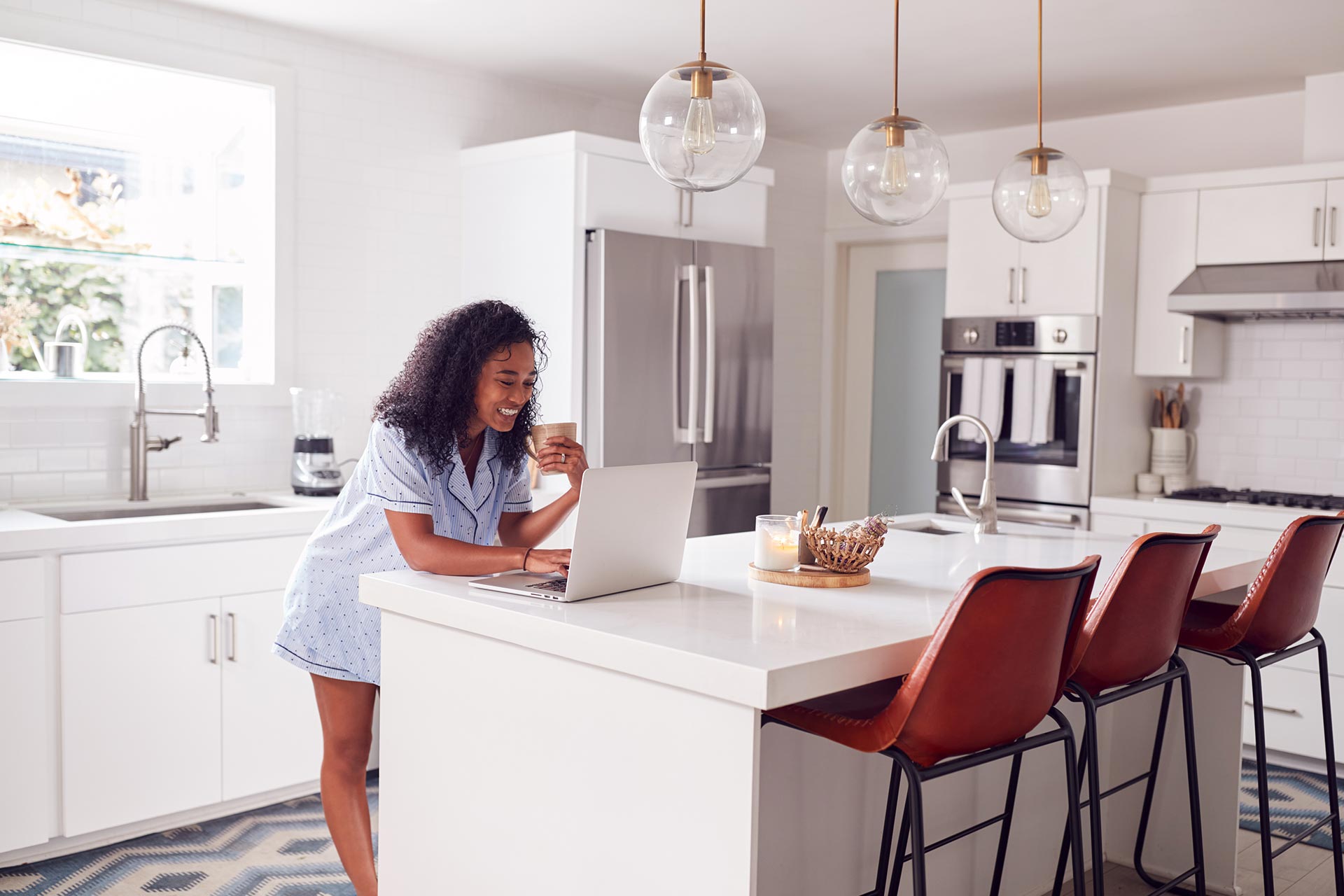 woman-wearing-pyjamas-standing-in-kitchen-working-2022-02-02-03-57-35-utc.jpg