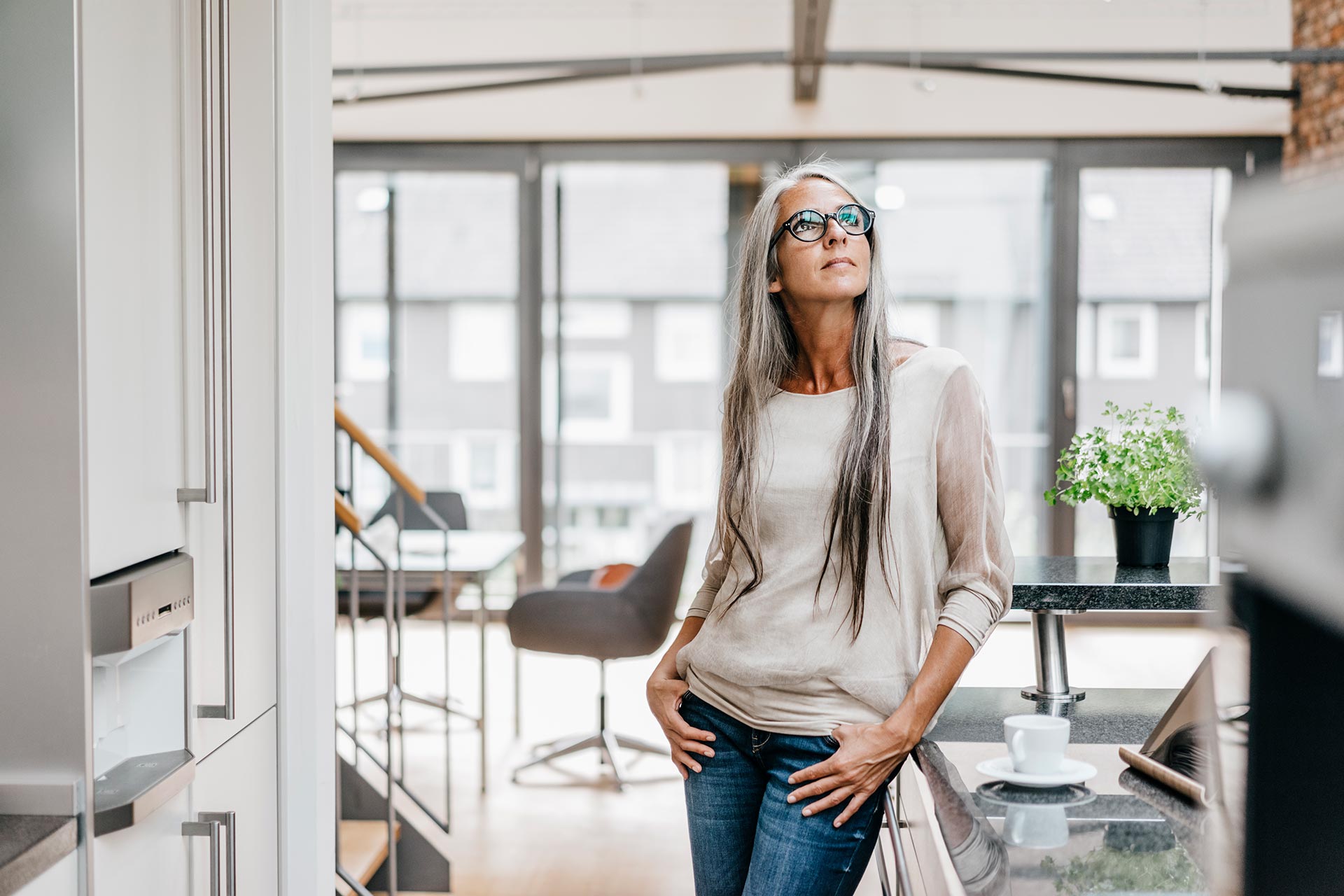 woman-with-long-grey-hair-in-kitchen-looking-up-2022-11-06-22-48-46-utc.jpg